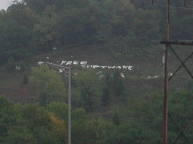  [Photo: 'Free Software', written in large white letters
          on a mountain side] 